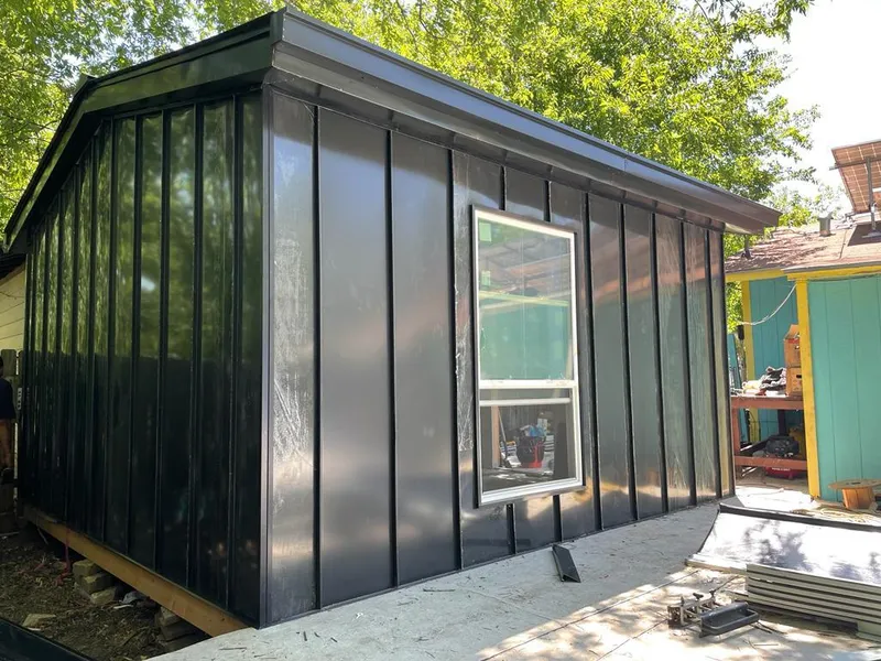 Black standing seam metal wall panels for Roof Inspection in Pharr