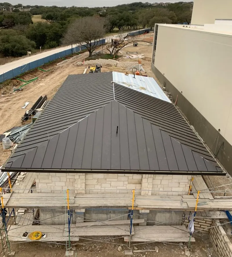 Metal roof new construction with scaffolding in Pharr